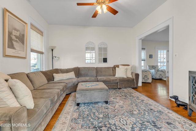 living room with ceiling fan and hardwood / wood-style floors