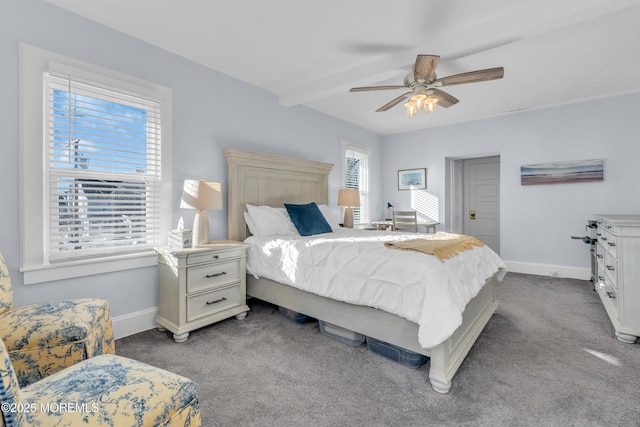 bedroom featuring light carpet, ceiling fan, and beam ceiling