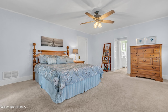 bedroom featuring ceiling fan and light carpet