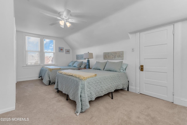 bedroom with ceiling fan, light carpet, and lofted ceiling