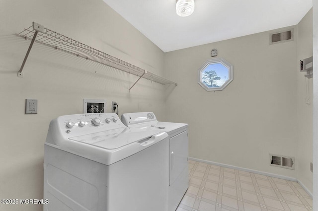 washroom with washer and dryer