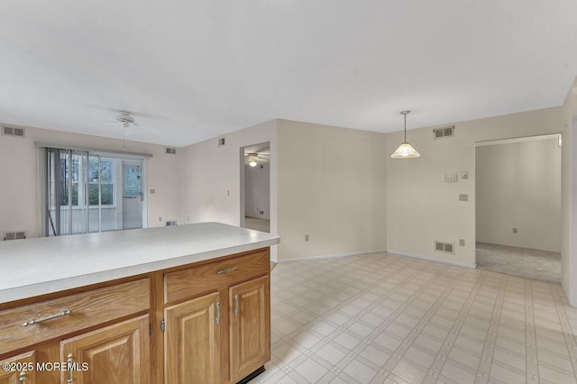 kitchen with pendant lighting and ceiling fan