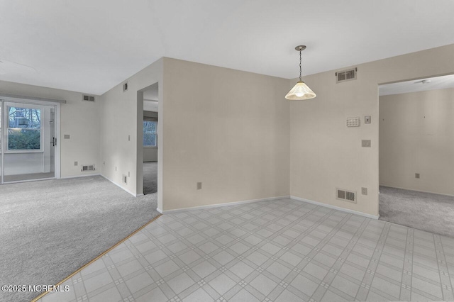 empty room with light colored carpet