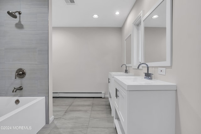 bathroom featuring vanity, tiled shower / bath combo, and a baseboard heating unit