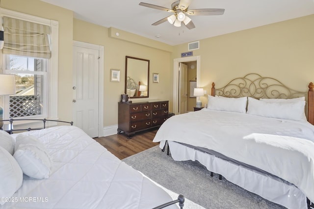 bedroom featuring dark wood-type flooring and ceiling fan