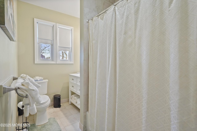 bathroom featuring toilet, vanity, tile patterned flooring, and a shower with curtain