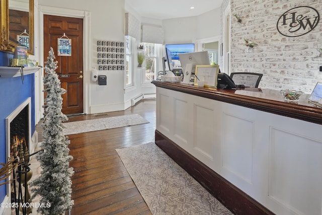 entryway featuring a baseboard radiator and dark hardwood / wood-style floors