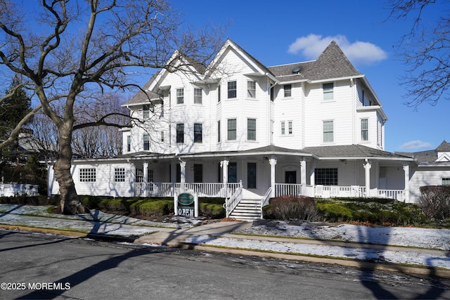 victorian-style house with a porch