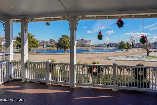 deck featuring a water view