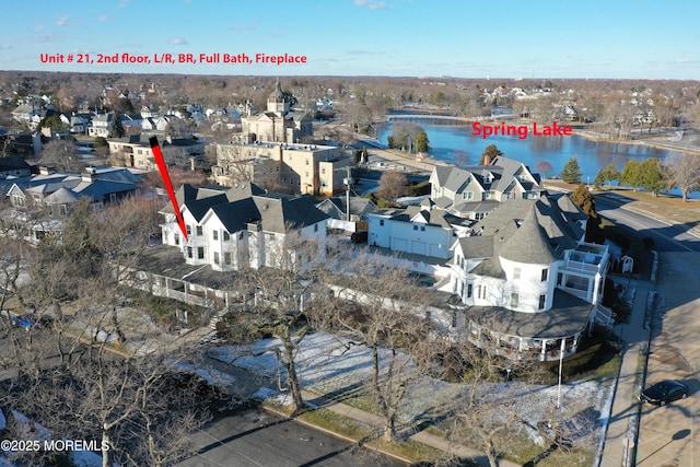 birds eye view of property with a water view