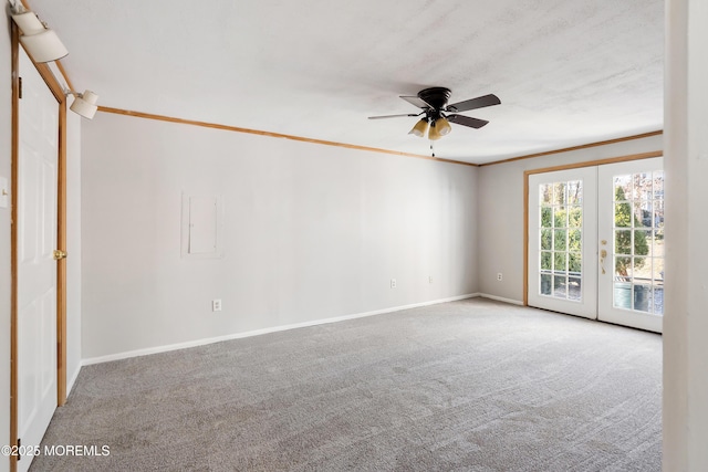 unfurnished room featuring ceiling fan, ornamental molding, french doors, and carpet floors