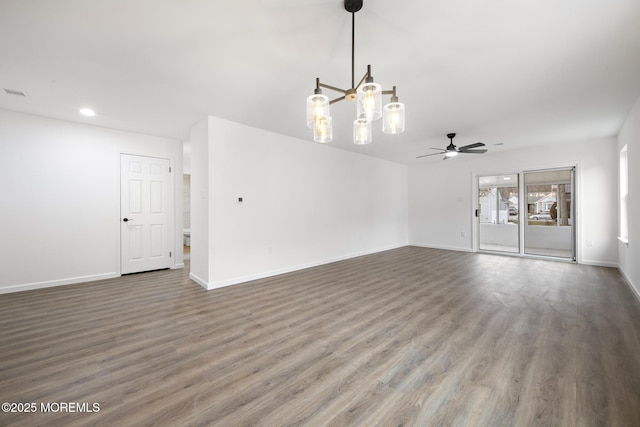 unfurnished living room featuring ceiling fan and hardwood / wood-style floors