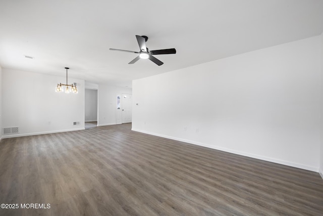 unfurnished living room featuring dark hardwood / wood-style floors and ceiling fan with notable chandelier