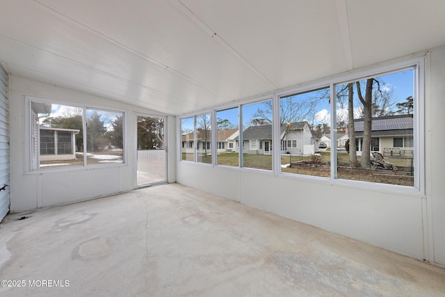 unfurnished sunroom with lofted ceiling