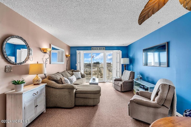 carpeted living room featuring a textured ceiling