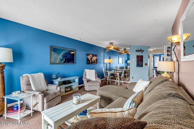 living room with carpet flooring, a textured ceiling, and ceiling fan