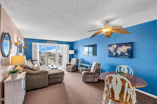 carpeted living room with a textured ceiling and ceiling fan