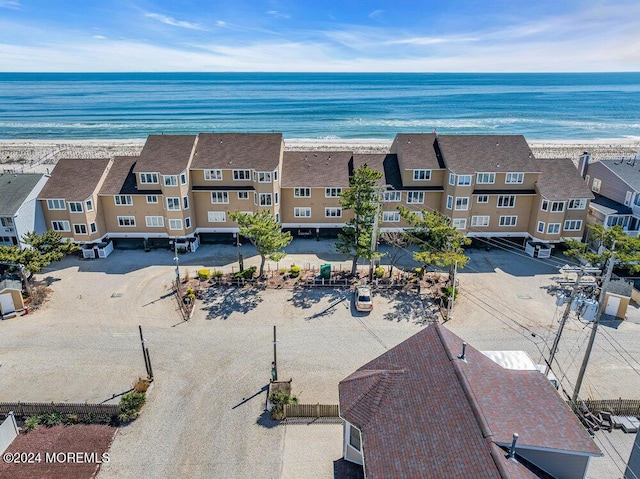 aerial view featuring a view of the beach and a water view