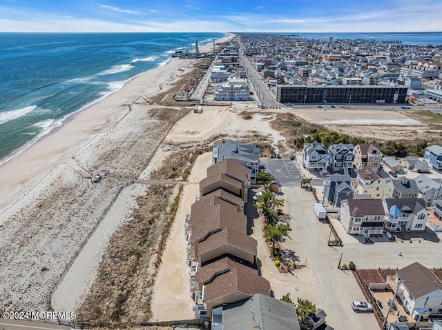 bird's eye view with a view of the beach and a water view