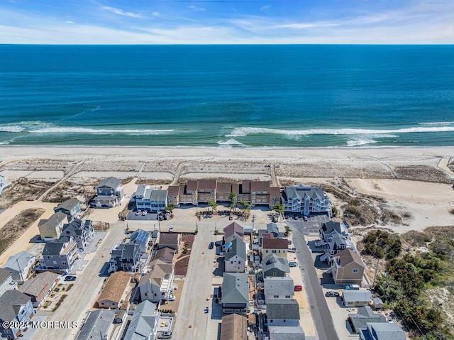 bird's eye view with a view of the beach and a water view