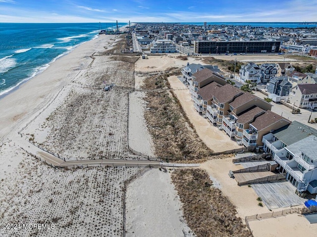 bird's eye view featuring a beach view and a water view