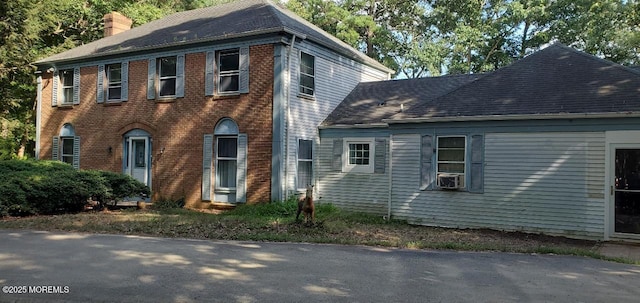 view of front of home featuring cooling unit