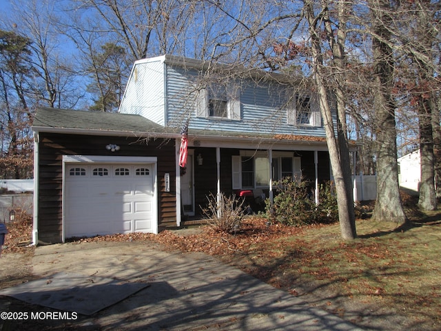 view of front of property with a garage and covered porch