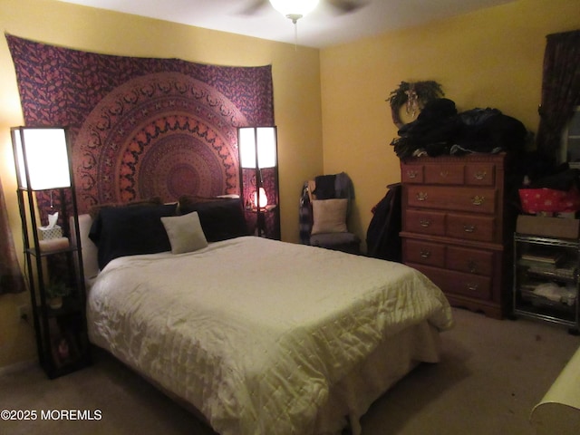 bedroom with ceiling fan and carpet floors