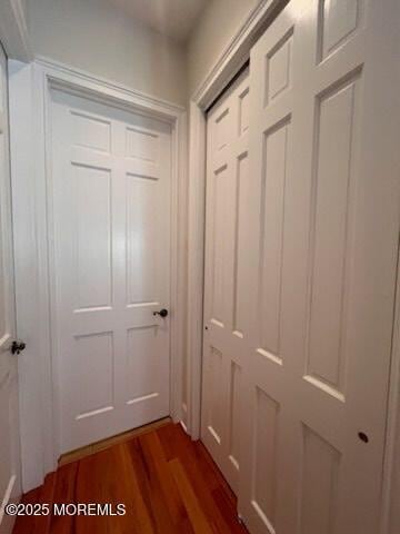 hall with dark hardwood / wood-style floors