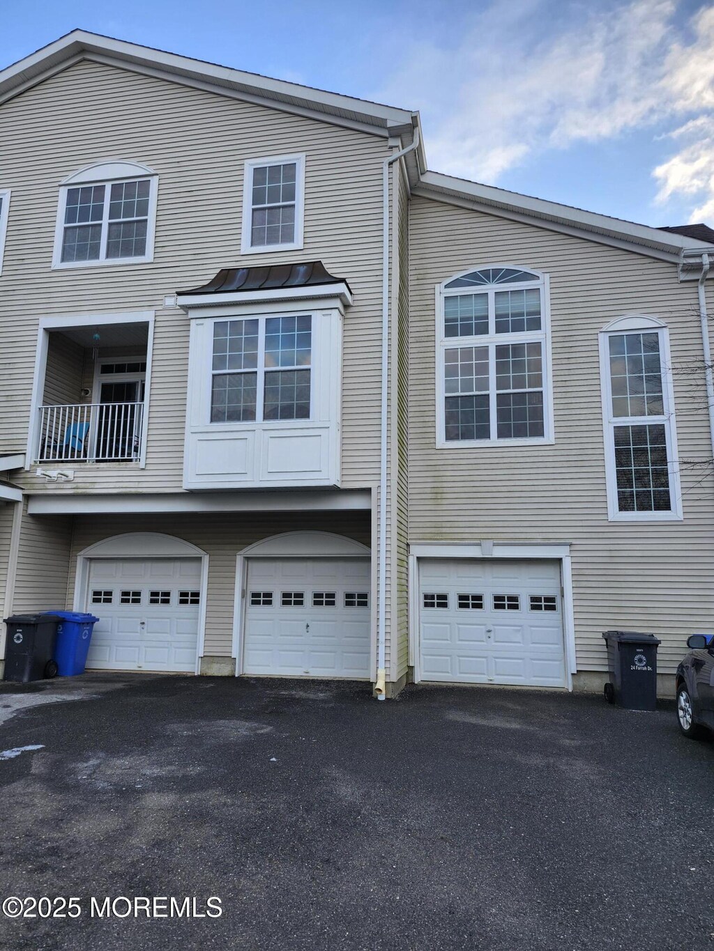 multi unit property featuring a garage