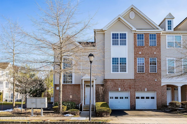 multi unit property featuring a garage