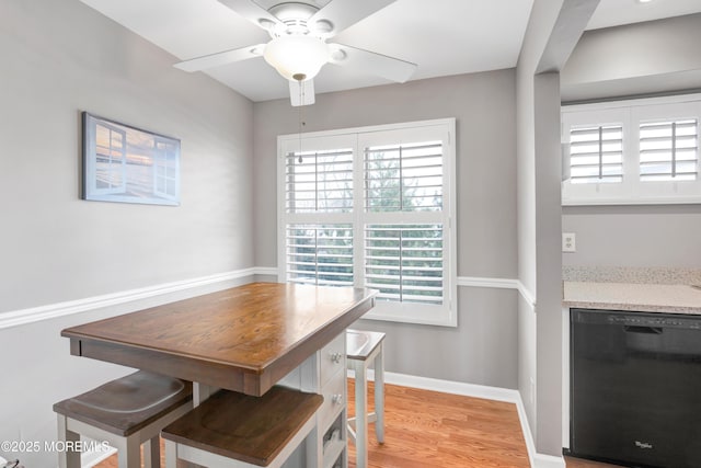 dining room with light wood-type flooring and ceiling fan