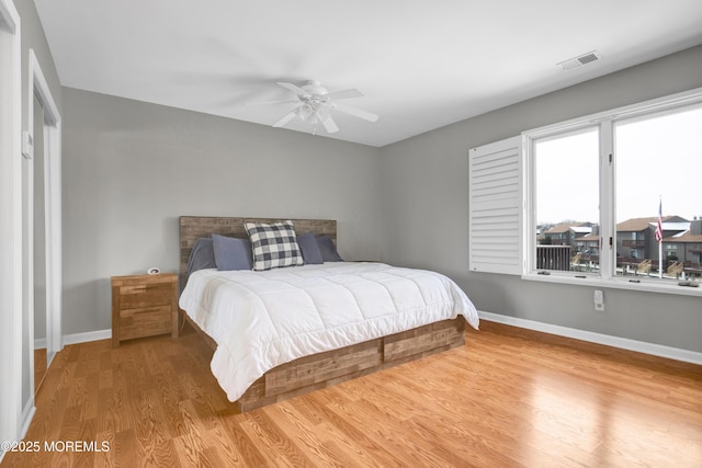 bedroom featuring ceiling fan and hardwood / wood-style flooring