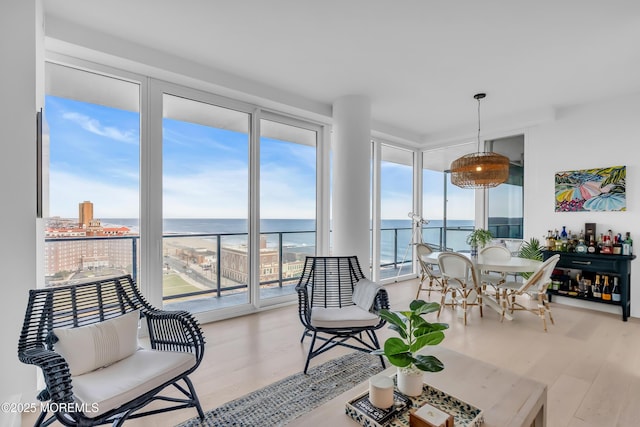 sunroom / solarium with a water view