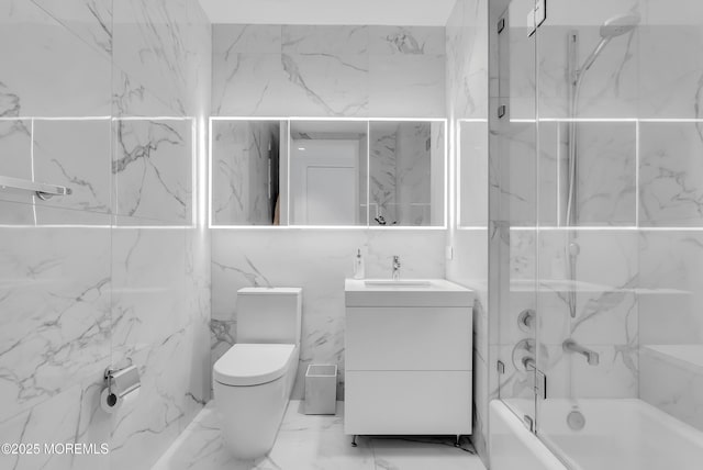 full bathroom featuring washtub / shower combination, vanity, and toilet