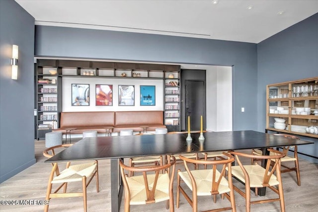 dining space with light wood-type flooring