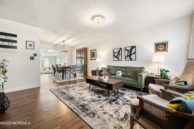 living room with dark hardwood / wood-style flooring