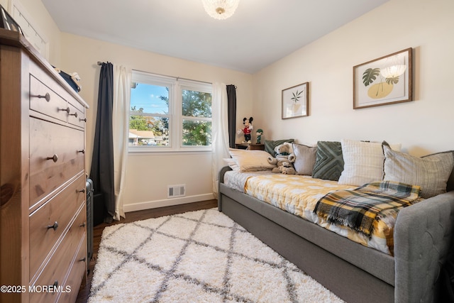 bedroom with wood-type flooring