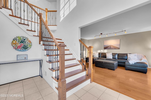 stairs featuring tile patterned flooring