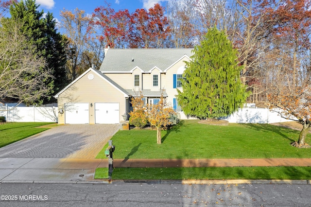 view of front property featuring a front yard and a garage