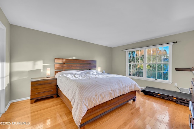 bedroom with light hardwood / wood-style flooring