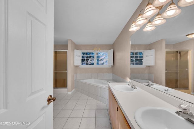 bathroom with separate shower and tub, tile patterned flooring, an inviting chandelier, and vanity