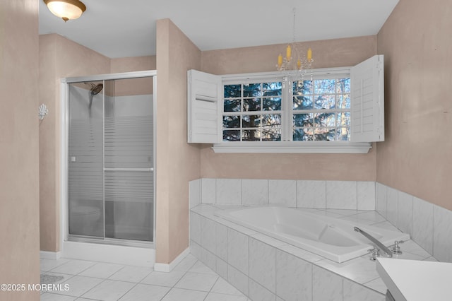 bathroom featuring independent shower and bath, vanity, tile patterned flooring, and a chandelier