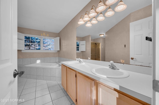 bathroom featuring separate shower and tub, tile patterned flooring, and vanity