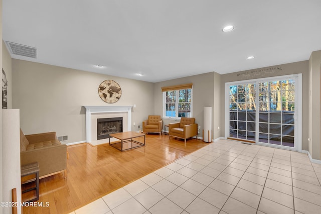 unfurnished living room with light tile patterned floors