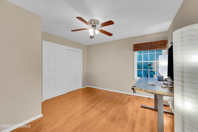 bedroom featuring a closet, ceiling fan, and light hardwood / wood-style flooring