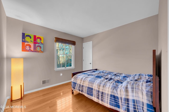 bedroom featuring hardwood / wood-style flooring