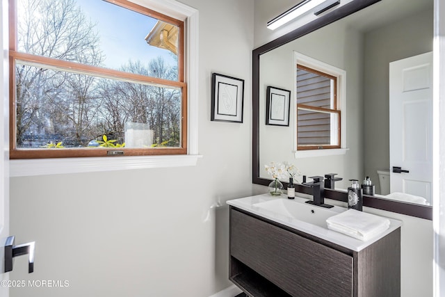 bathroom with vanity and toilet