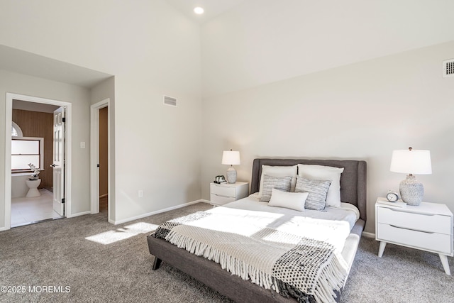 carpeted bedroom with connected bathroom