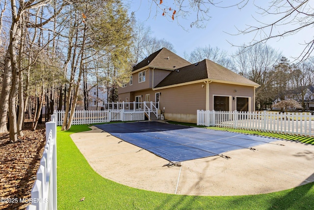 view of pool featuring a yard and a patio area